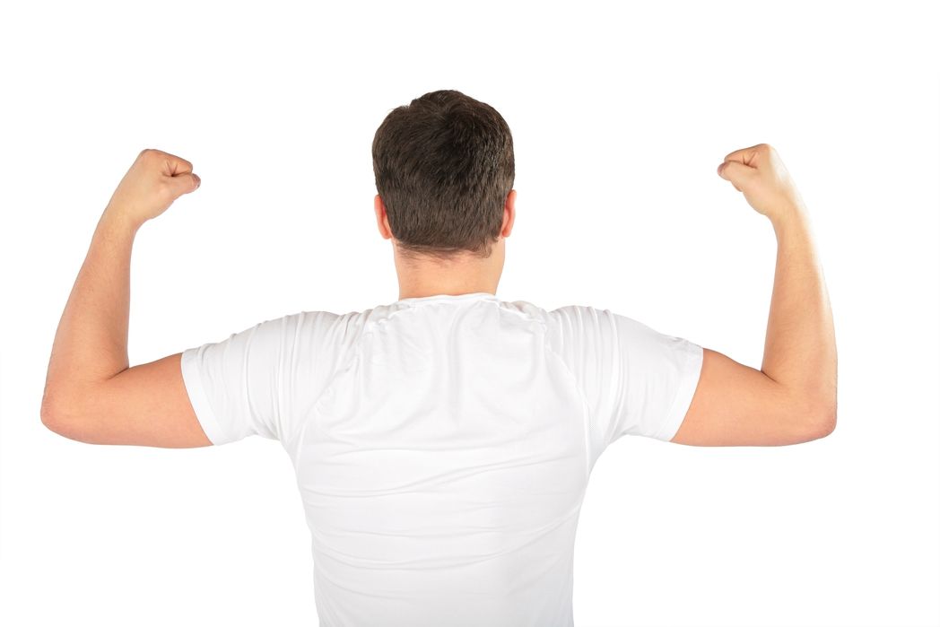 The back of a man wearing a white shirt