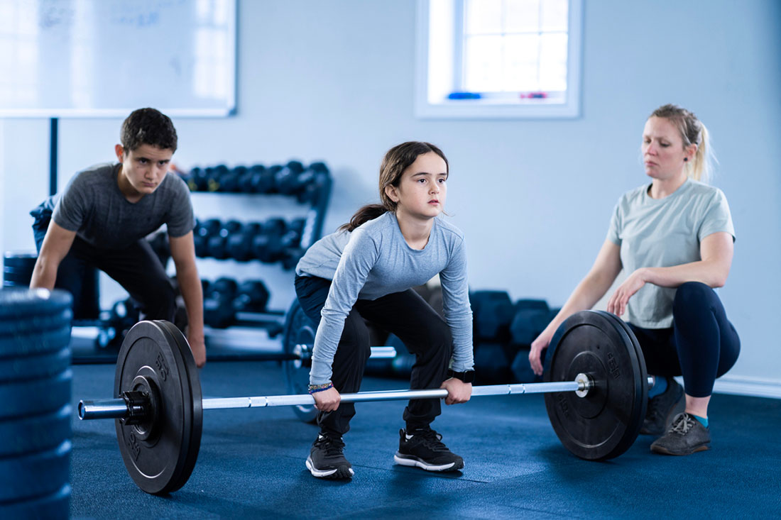 young girl weightlifting