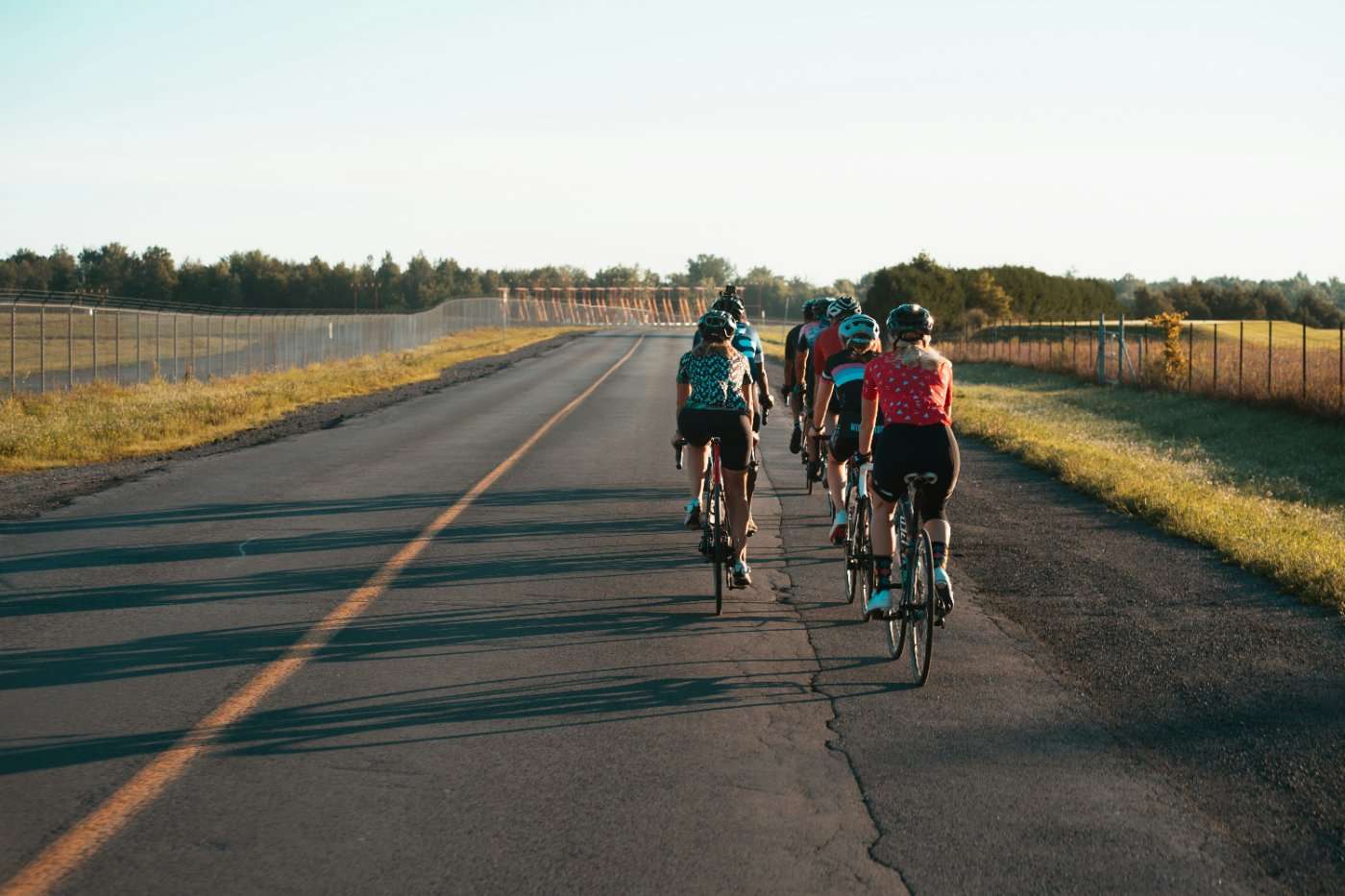Group of cyclists riding on rural road near Burlington Ontario outdoors